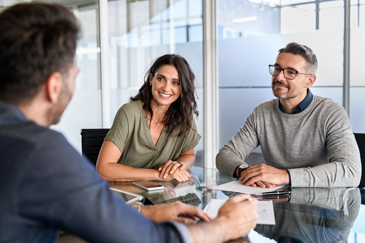 Mature couple meeting financial advisor for investment stock photo